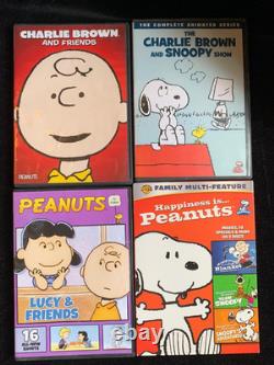 Big Lot Of Peanuts Snoopy Figurine Books Book Ends DVD Puzzles Cards Collection