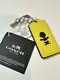 Coach X Peanuts Snoopy Charlie Brown Yellow Leather Hangtag Keychain Fob Charm