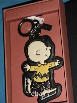 Coach x Peanuts Charlie Brown Ice-Skating Charm in Snoopy Box. 20926 B