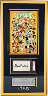 Carte de vœux signée par Charles Schulz avec photo des Peanuts encadrée, certificat PSA COA
