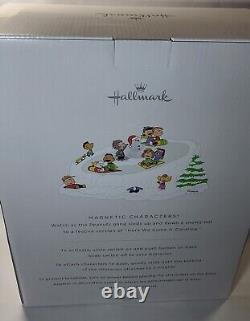 Figurine musicale de la bande des Peanuts en train de faire de la luge avec mouvement Charlie Brown Snoopy