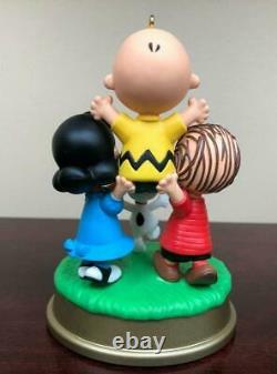 Hallmark Snoopy Charlie Brown Torso Raising Ornament