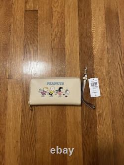 Porte-monnaie à poignet Coach Peanuts Snoopy Charlie Brown Lucy patinage sur glace NWT 328 $