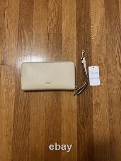 Porte-monnaie à poignet Coach Peanuts Snoopy Charlie Brown Lucy patinage sur glace NWT 328 $