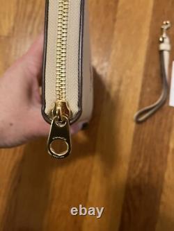 Porte-monnaie à poignet Coach Peanuts Snoopy Charlie Brown Lucy patinage sur glace NWT 328 $