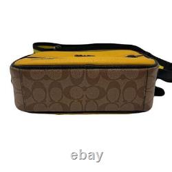 Sac à bandoulière Auth Coach en cuir jaune collaboration Snoopy Charlie Brown